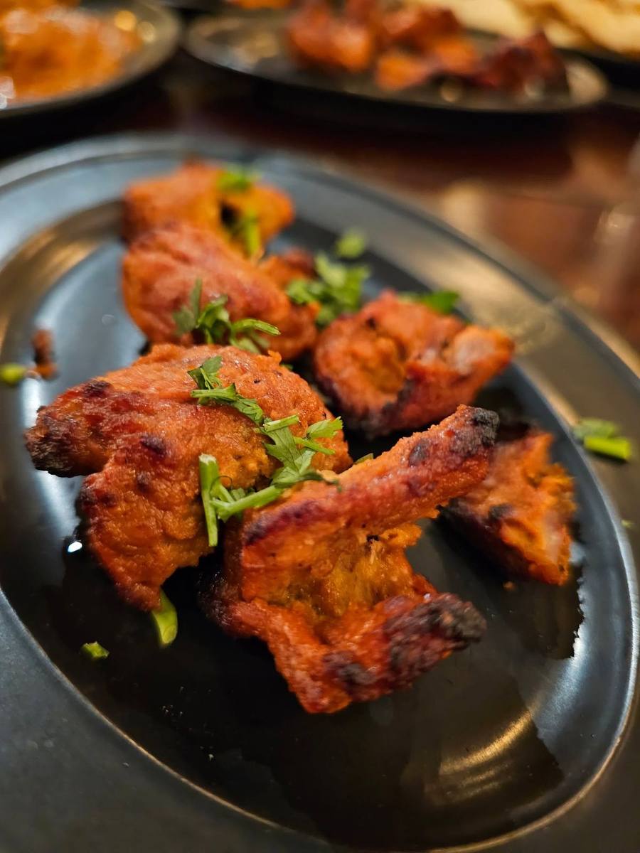 Chicken tandoori kebab pieces garnished with coriander